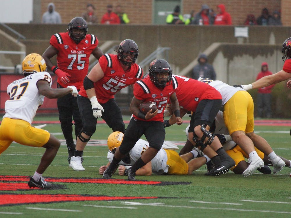 Redshirt junior running back Marquez Cooper rushes between tackles against Toledo Oct. 14 at Scheumann Stadium. Cooper had 60 rushing yards in the 13-6 loss to the Rockets. Daniel Kehn, DN