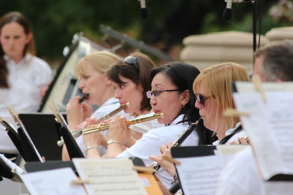 The Muncie Symphony Orchestra flute section plays during the 2013 Festival on the Green. This year