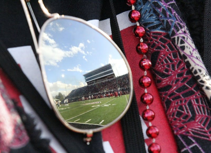 Schuemann Stadium reflects off of a fan's sunglasses during Ball State's game against Eastern Michigan Oct. 20, 2018. Ball State lost 42-20 on Homecoming. Paige Grider, DN