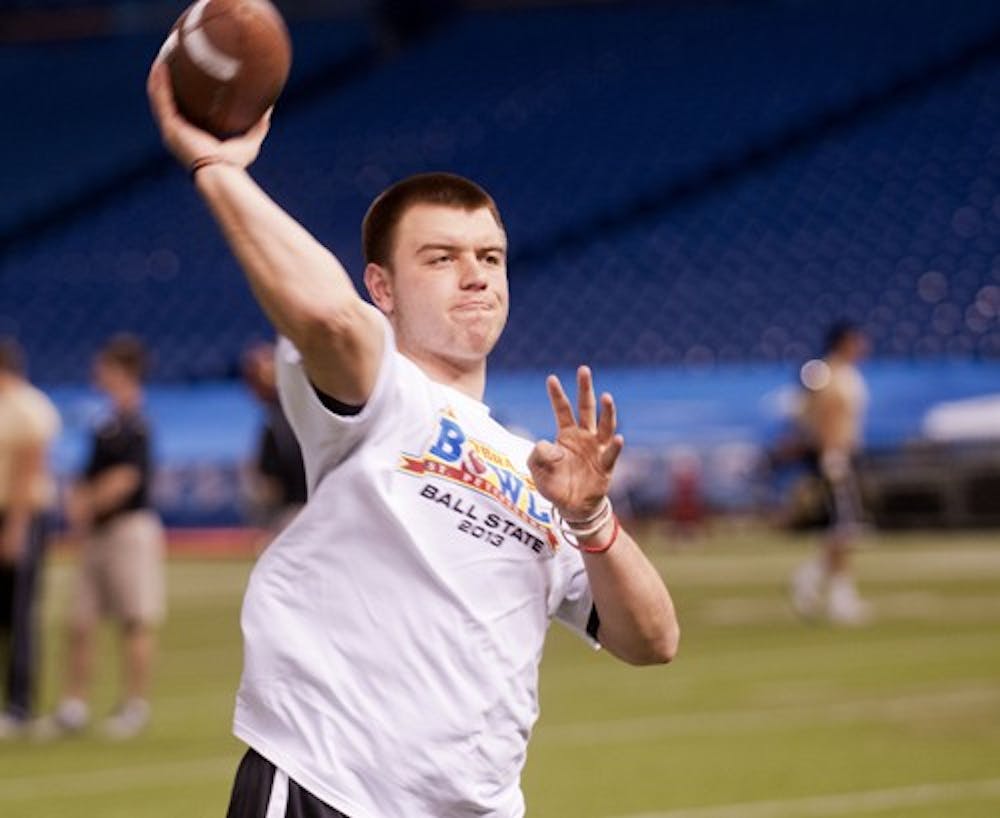 Junior quarterback Keith Wenning warms-up before the Beef 'O' Brady's Bowl on Friday, Dec. 21. The junior quaterback missed the Cardinal's season finale with an injury but is scheduled to start in the bowl game. DN PHOTO BOBBY ELLIS