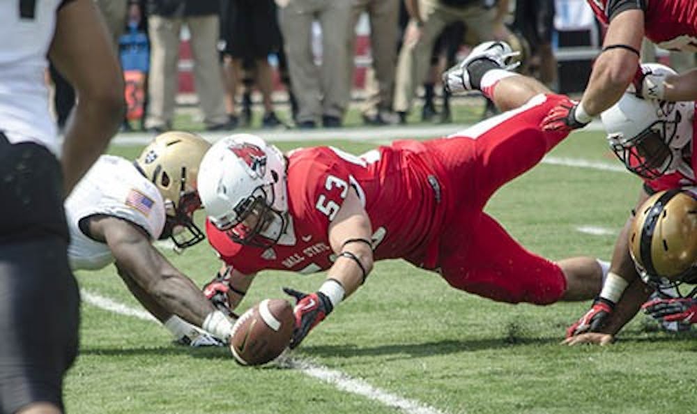 Redshirt freshman linebacker Zack Ryan tries to recover a fumble in the first quarter of the game against Army on Sept. 7. Ryan has started two games as linebacker this season. DN FILE PHOTO COREY OHLENKAMP
