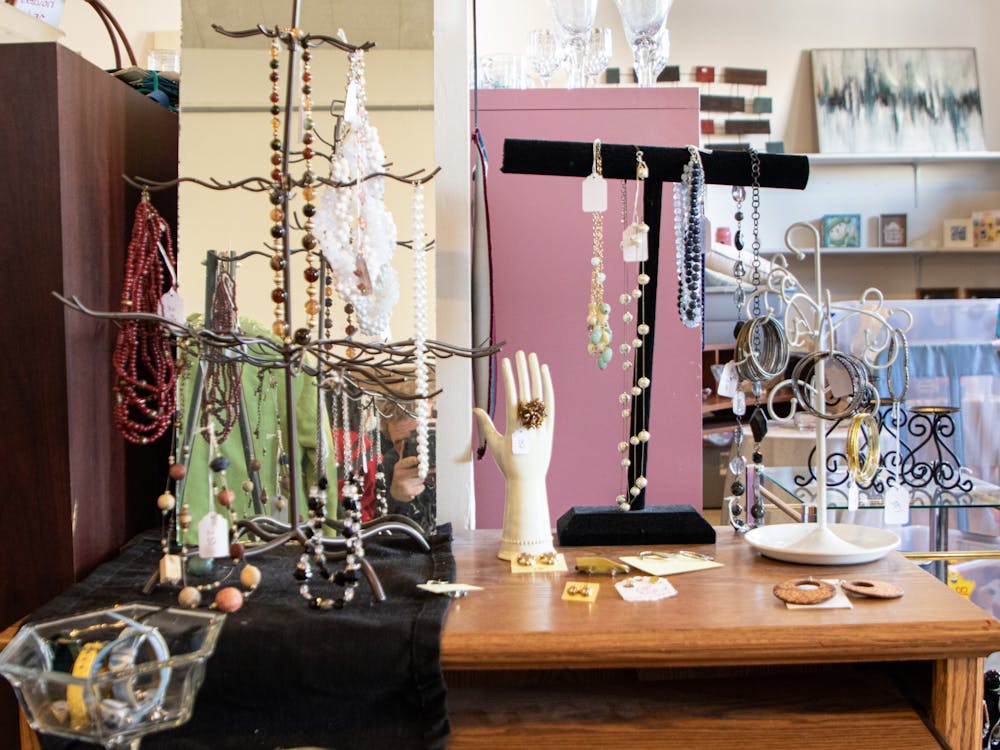 Earrings, necklaces, and bracelets hang near the entrance of the Muncie YWCA's Twice as Nice resale shop Feb. 25. Gena Coers, a volunteer and Tri Kappa member, said that jewelry is one of their most popular items. Alex Bracken, DN