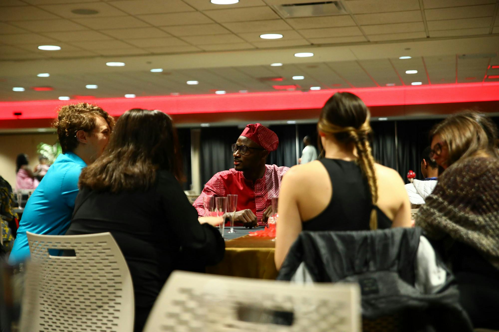 Graduate student Akin Akinola speaks with guests March 31 at the first annual Afro Gala at the Student Center. Jacy Bradley, DN