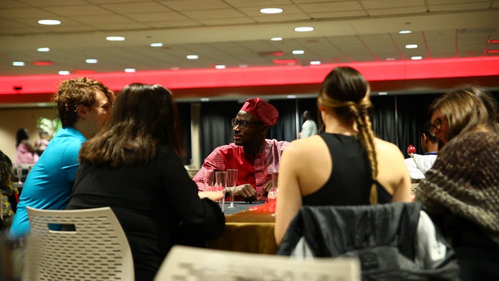 Graduate student Akin Akinola speaks with guests March 31 at the first annual Afro Gala at the Student Center. Jacy Bradley, DN