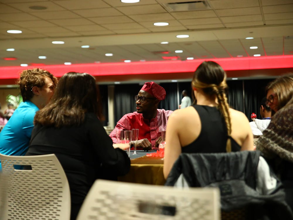 Graduate student Akin Akinola speaks with guests March 31 at the first annual Afro Gala at the Student Center. Jacy Bradley, DN
