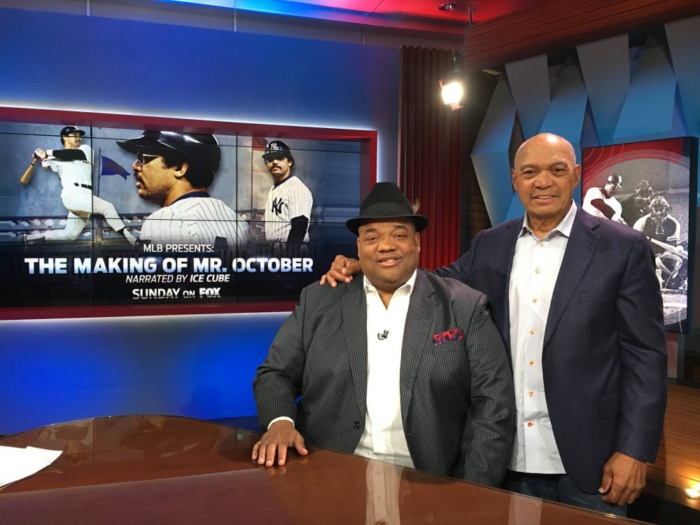 <p>Former Ball State football player Jason Whitlock (left) poses with Reggie Jackson (right) on the set of his&nbsp;T.V. sports show Speak For Yourself. Whitlock also writes for ESPN and has over&nbsp;252,000 followers on Twitter.<em>&nbsp;</em><em>Jason Whitlock // Photo Provided</em></p>