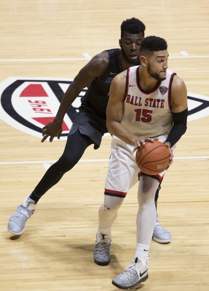 Senior forward Franko House looks for an open teammate during the game against Buffalo on Feb. 3 at Worthen Arena. Ball State lost 96-69. Emma Rogers // DN