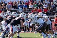 Ball State's offensive line defends the ball as Western Michigan's defense pushes forward Oct. 5 at Schuemann Stadium. Ella Absher, DN