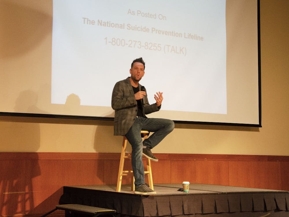 Josh Rivedal recounts his past Nov. 28, 2018, in the Student Center Ballroom. Rivedal offered advice about staying aware of those around us and the importance of mental health in his program “The i’Mpossible Project” hosted by SGA and Greek Life. Pauleina Brunnemer,DN.