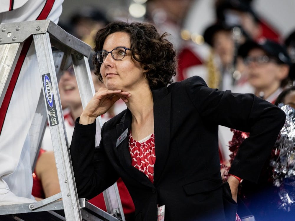 Caroline Hand, associate director of bands, looks on as Ball State football played Indiana University in Lucas Oil Stadium, Aug. 31, 2019. The band practices three times a week. Eric Pritchett, DN