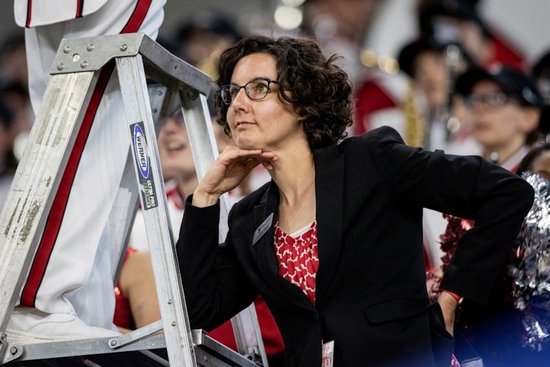 Caroline Hand, associate director of bands, looks on as Ball State football played Indiana University in Lucas Oil Stadium, Aug. 31, 2019. The band practices three times a week. Eric Pritchett, DN