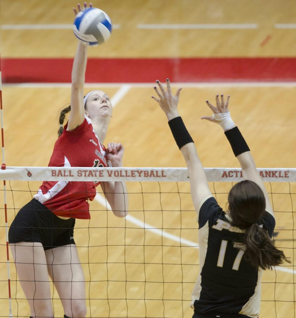 Junior middle blocker Hayley Benson hits the ball in the scrimmage against Purdue University on March 29 at Worthen Arena. DN PHOTO BREANNA DAUGHERTY 