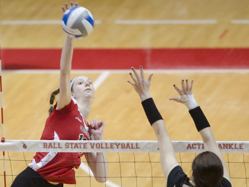 Junior middle blocker Hayley Benson hits the ball in the scrimmage against Purdue University on March 29 at Worthen Arena. DN PHOTO BREANNA DAUGHERTY 