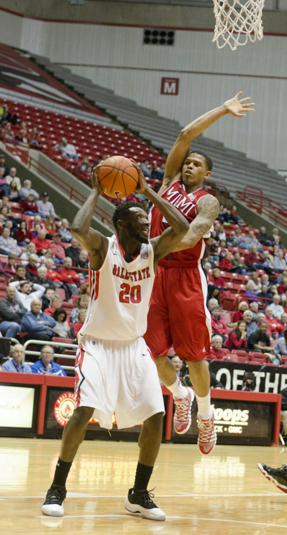 Senior forward Chris Bond goes for a shot as Miami defenders try to block him Jan. 18 at Worthen Arena. DN PHOTO BREANNA DAUGHERTY