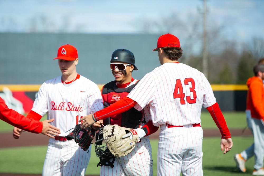 Junior catcher Matthew Gonzalez (middle) walks back with his teammates to the dugout after finishing an inning against Bowling Green March 15 at First Merchants Ball Park Complex. The Cardinals lost 4-5 against the Falcons. Isabella Kemper, DN