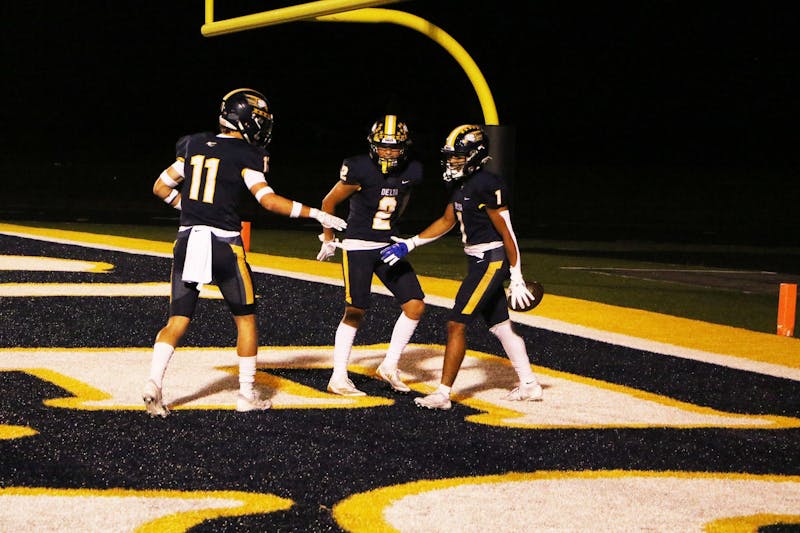 Delta players celebrate a touchdown in a game against Shelbyville at Delta High School on Friday, Sept. 7. David Moore, DN.