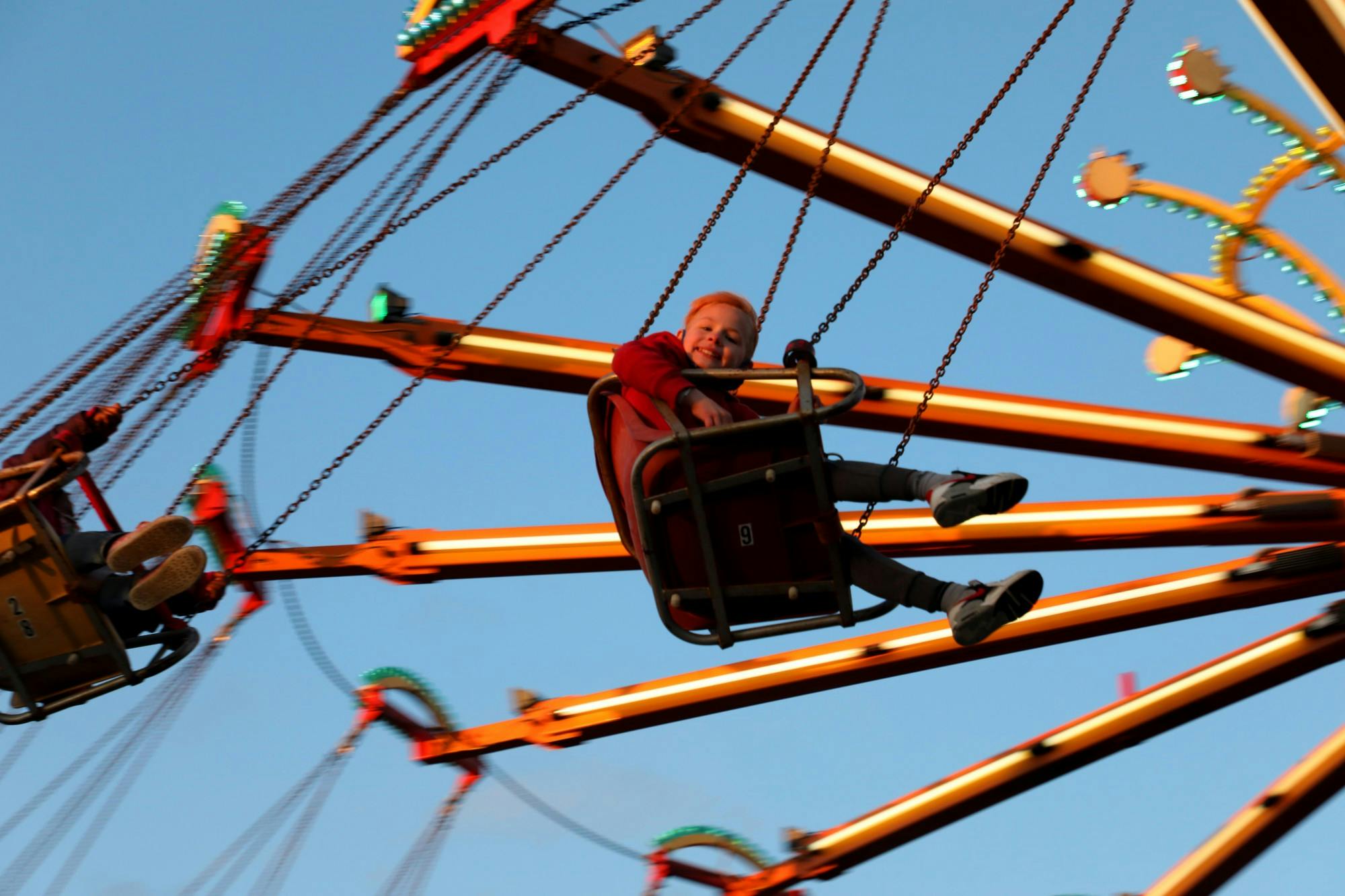 Kavion Riley rides a swing ride April 15, 2021, at the Muncie Mall Spring Fair. The fair is sponsored by Indiana-based company, Jessop Amusements. Rylan Capper, DN