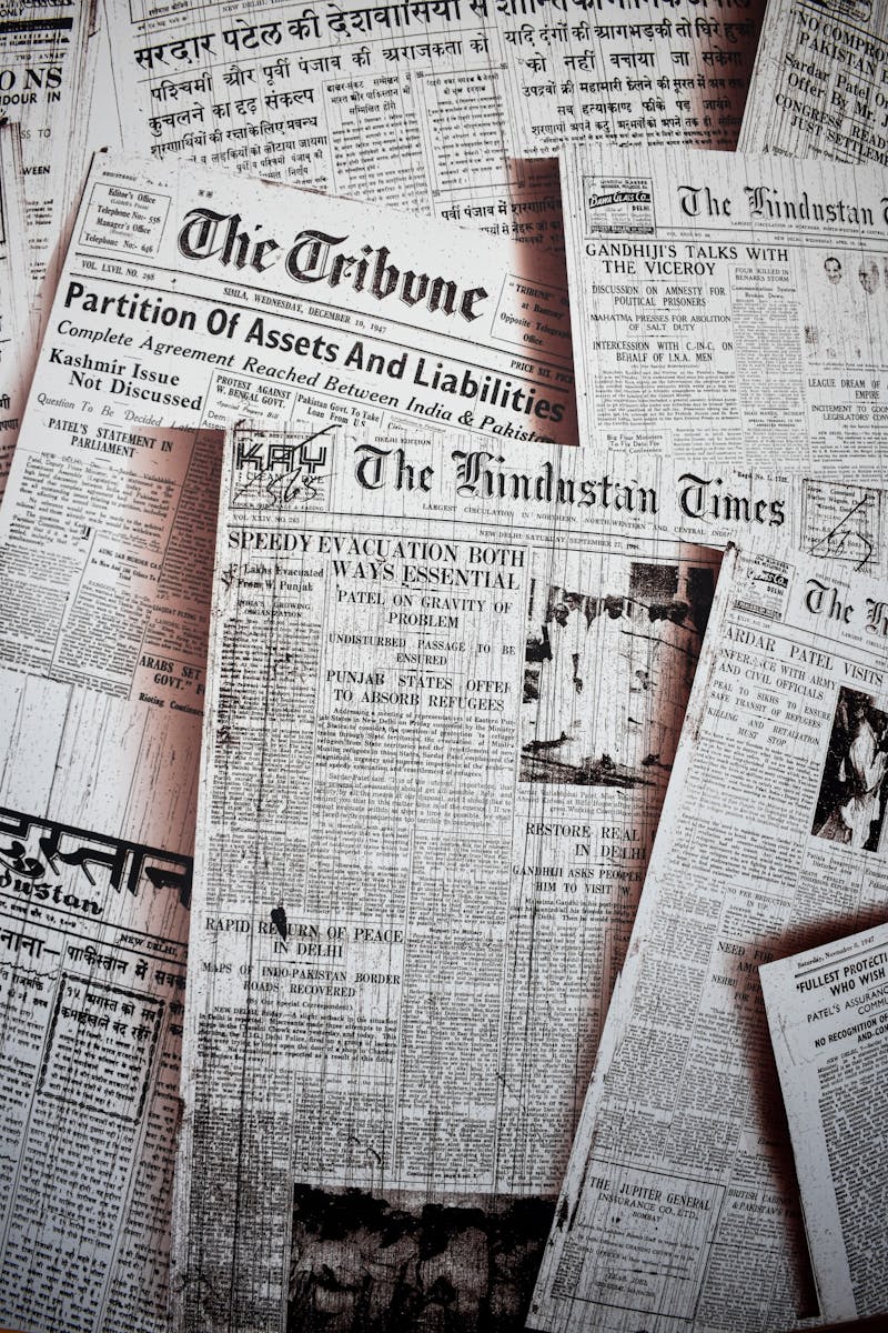 Archived newspapers are sprawled out for a photo. The freedom of the press has allowed newspapers to run for more than 230 years. Unsplash, Photo Courtesy