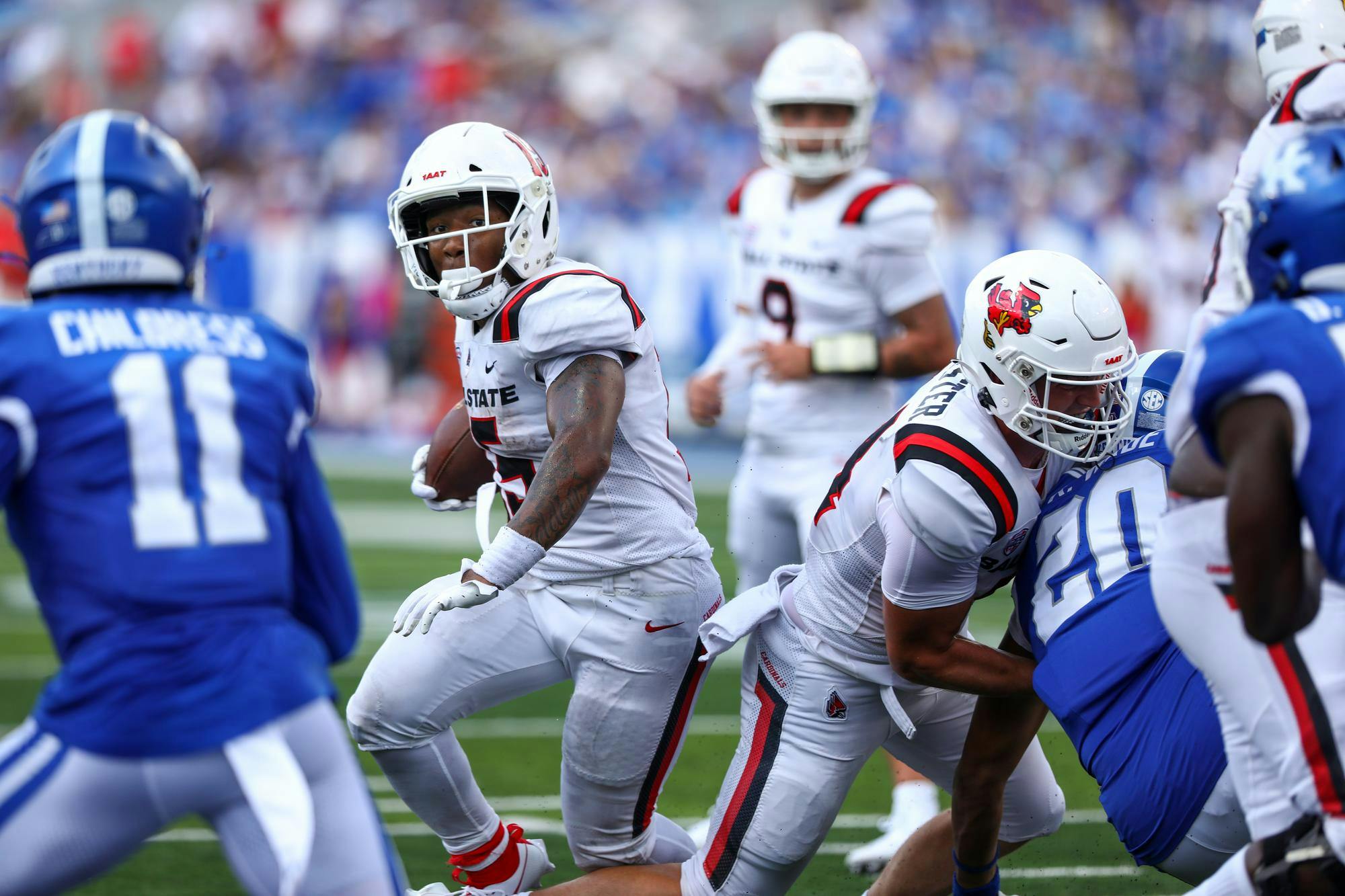 Redshirt junior running back Marquez Cooper rushes between linemen against Kentucky Sept. 2. Cooper had 33 yards in Ball State's 44-14 loss to the Wildcats. Daniel Kehn, DN