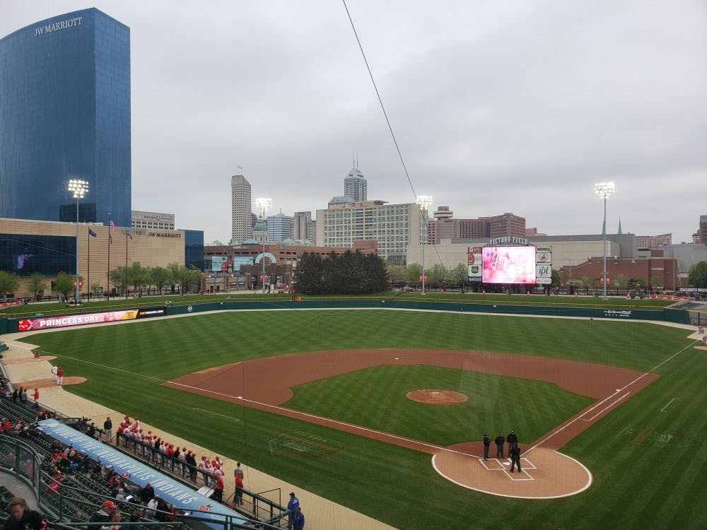 Ball State Baseball players and coaches line up for the national anthem for their game against Indiana April 23 at Victory Field in Indianapolis. The Cardinals fell to the Hoosiers, 9-3. Zach Piatt, DN