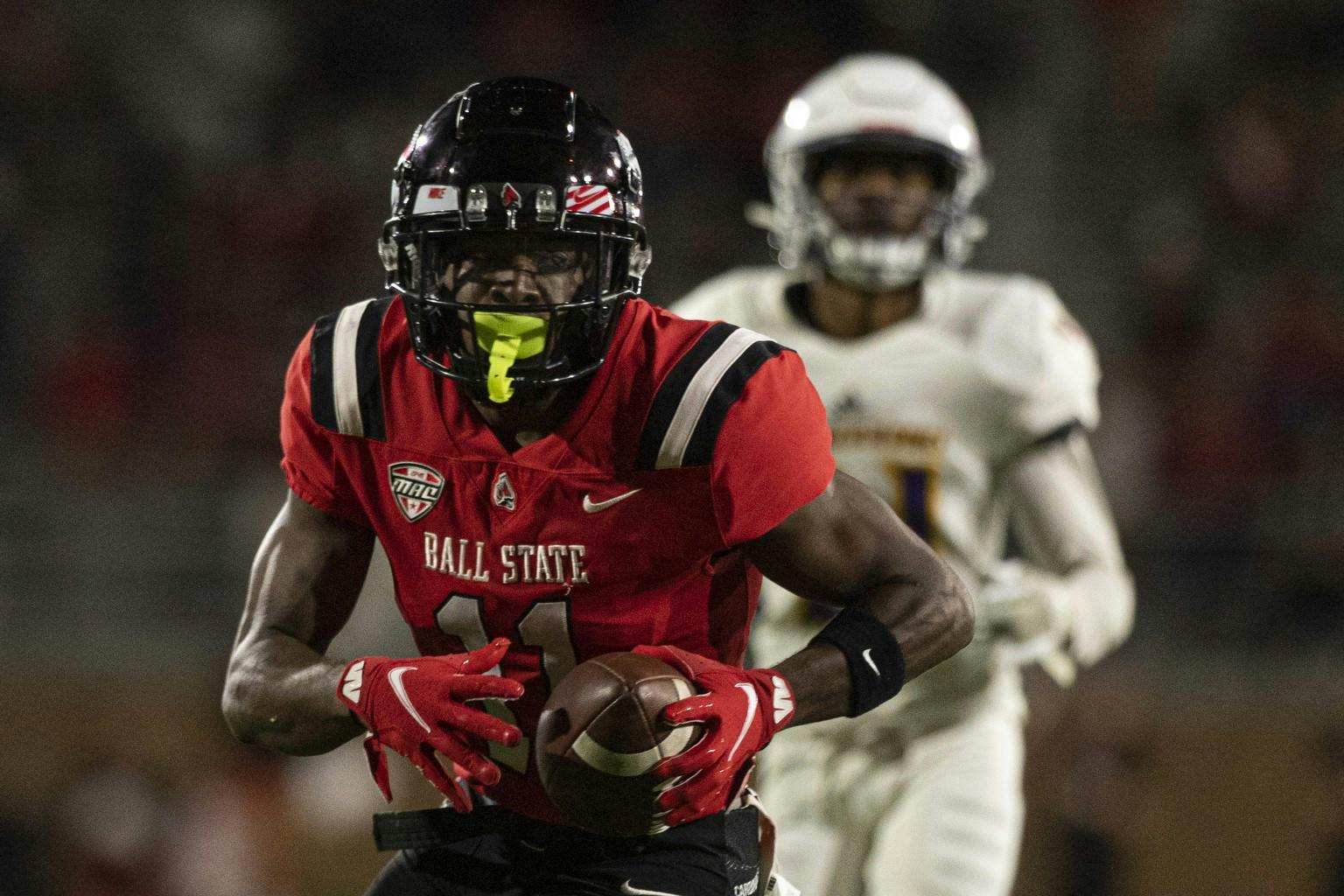 Cardinals fifth-year senior wide receiver Justin Hall runs the ball for a receiving touchdown against the Western Illinois Roughnecks Sept. 2, 2021, at Scheumann Stadium. The Cardinals beat Western Illinois in the home opener 31-21. Jacob Musselman, DN