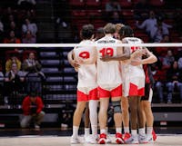 The Ball State mens volleyball team huddle between plays against Brigham Young Jan. 16 at Worthen Arena. Andrew Berger, DN 