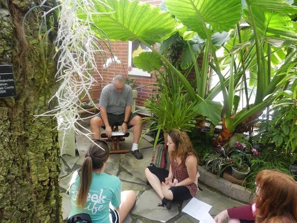 <p>Students and community members attended a meditation session at Rinard Orchid Greenhouse. The session occurs each week. PHOTO PROVIDED BY PHYLISIA DONALDSON</p>