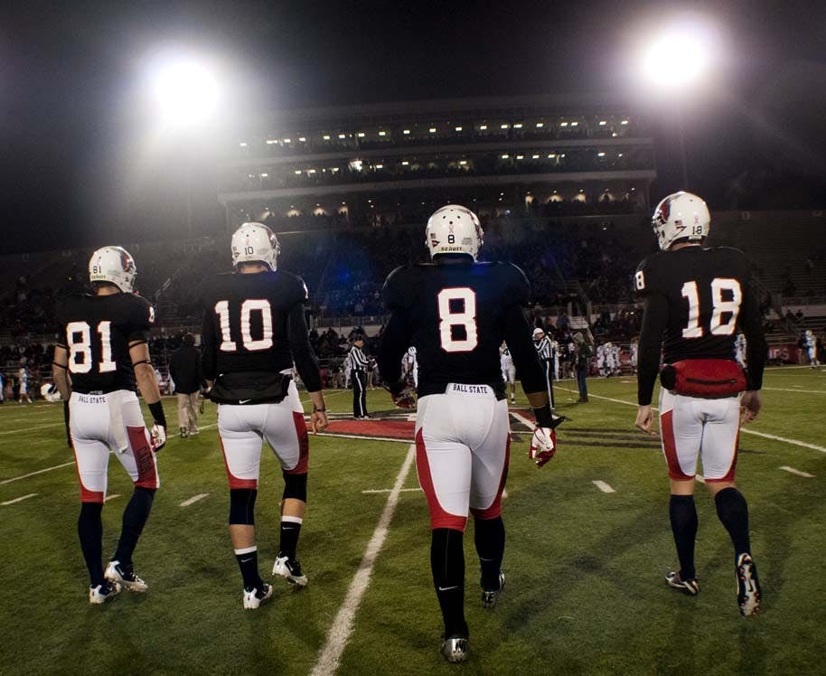 The Ball State captains walk out to the coin toss before the game. DN PHOTO BOBBY ELLIS