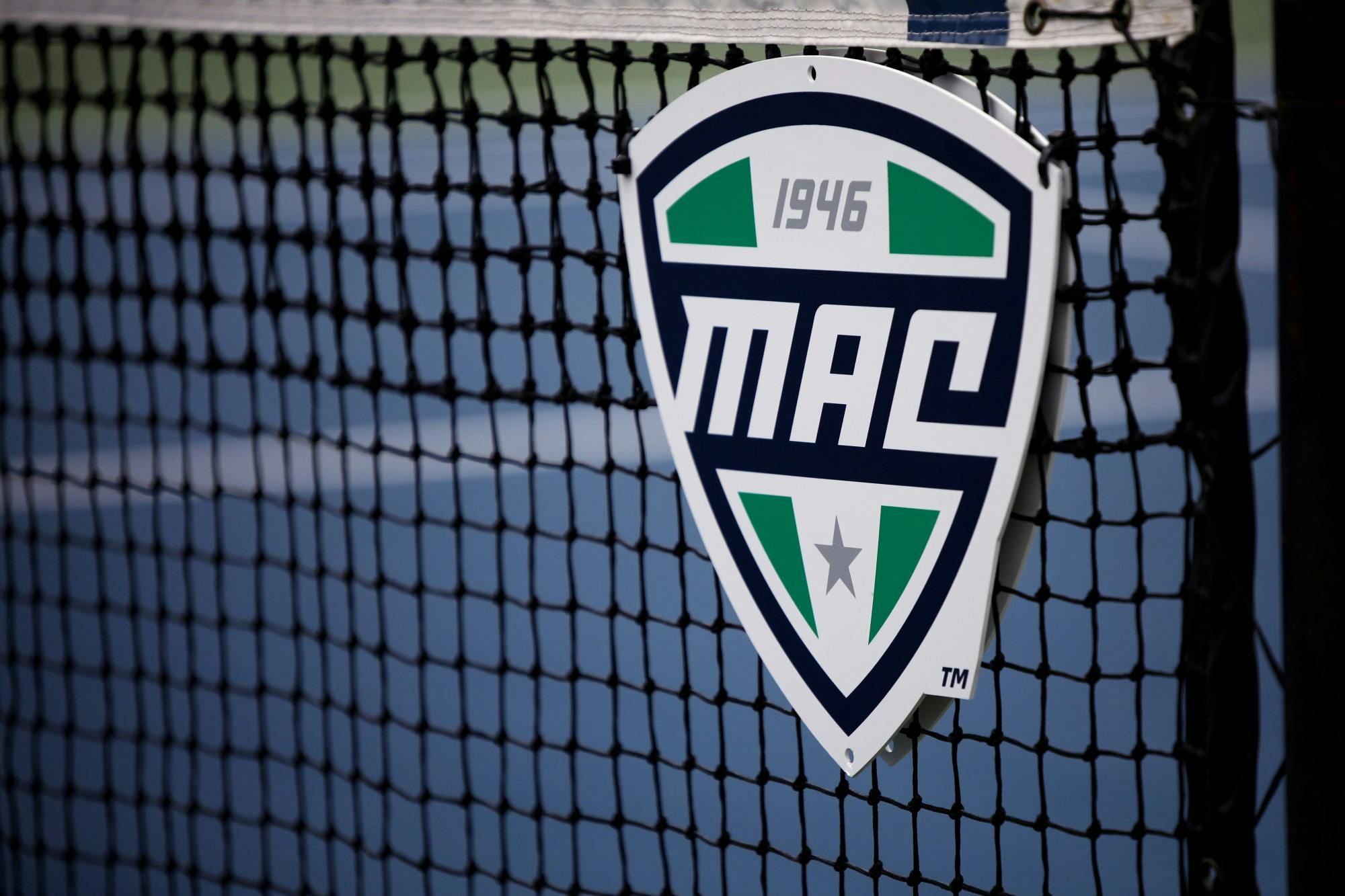 The MAC Conference logo sits on the net during the MAC Championship between Ball State and Toledo May 1 at Cardinal Creek Tennis Courts. Amber Pietz, DN