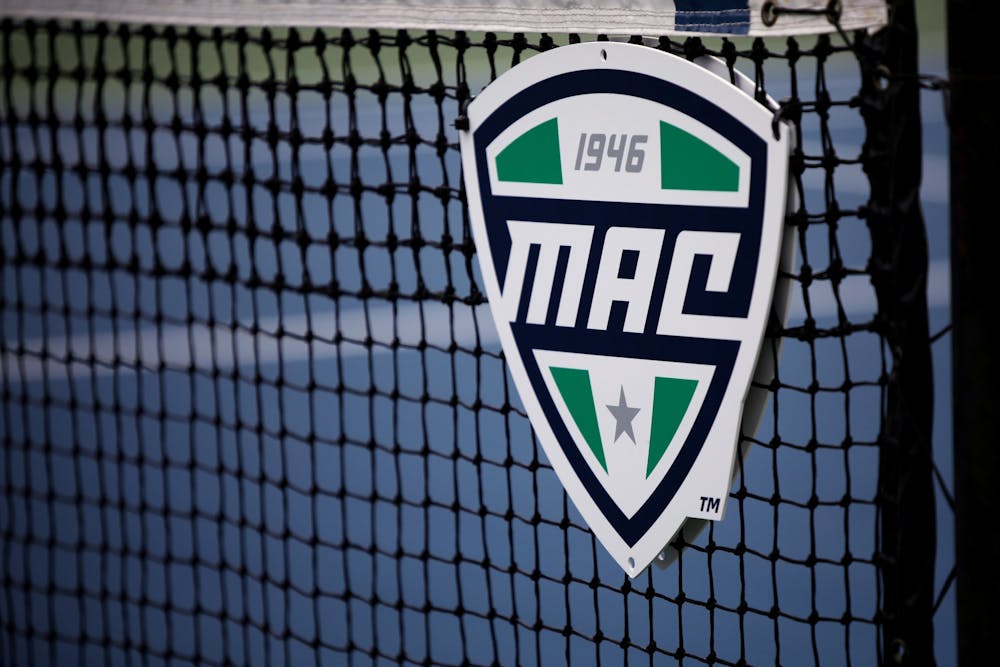 The MAC Conference logo sits on the net during the MAC Championship between Ball State and Toledo May 1 at Cardinal Creek Tennis Courts. Amber Pietz, DN