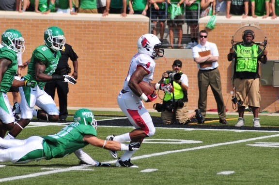 Horactio Banks attempts to dodge a tackle by North Texas during Saturday's game at Apogee Stadium. Ball State lost to North Texas 34-27. NTDAILY.COM PHOTO RYAN VANCE