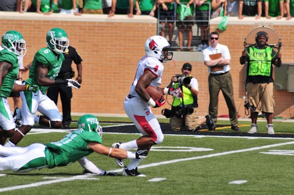 Horactio Banks attempts to dodge a tackle by North Texas during Saturday's game at Apogee Stadium. Ball State lost to North Texas 34-27. <a href="http://ntdaily.com/">NTDAILY.COM</a> PHOTO RYAN VANCE