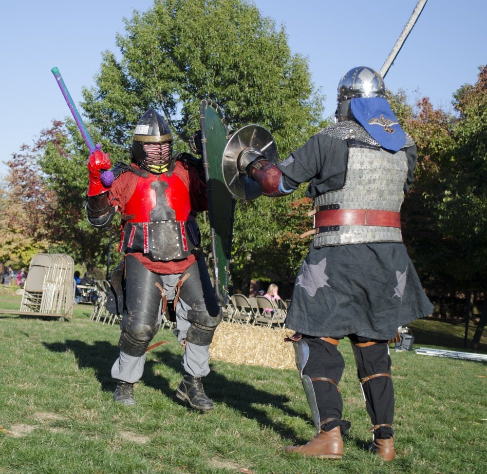 Members of Shadow Star take part in a combat exposition at the Renaissance Faire Oct. 16 on the University Green. DN PHOTO BREANNA DAUGHERTY
