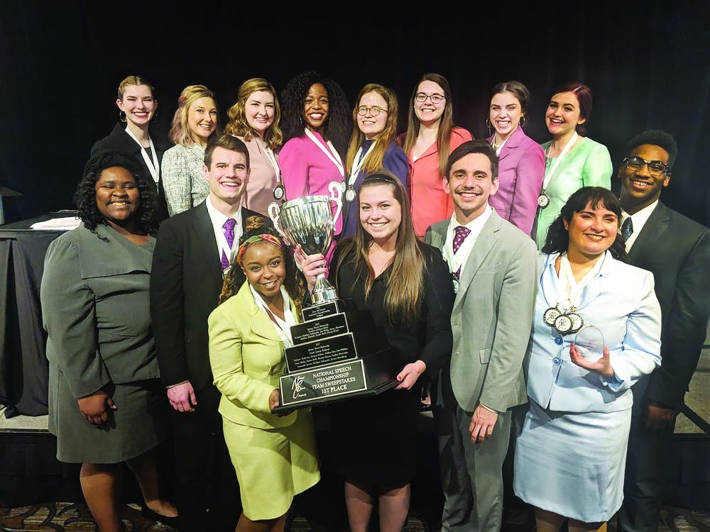 The Ball State Speech Team holds their trohpies after winning the National Speech Championship March 24 in Rochester, Michigan. The team also secured three individual national titles alongside their team win. Ball State Speech Team, Photo Provided