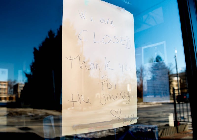 A sign that says "We are closed. Thank you for the journey," is pasted on the window of what used to be Muncie's Two Cats Cafe. Two Cats closed their doors Dec. 13, 2018, after owner Basam Helwani accepted an offer with Pocket Points. Mallory Huxford, DN
