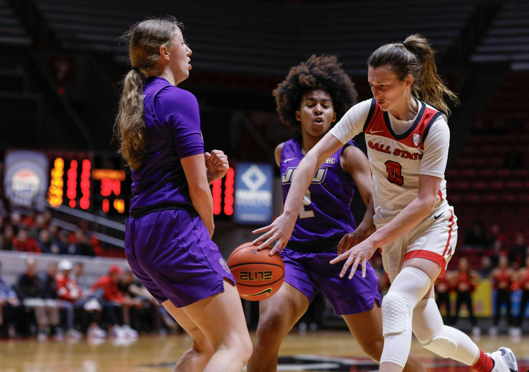 Junior Ally Becki makes a split pass through the defense against James Madison Feb. 11 at Worthen Arena. Becki had three points in the first half against the Dukes. Andrew Berger, DN 