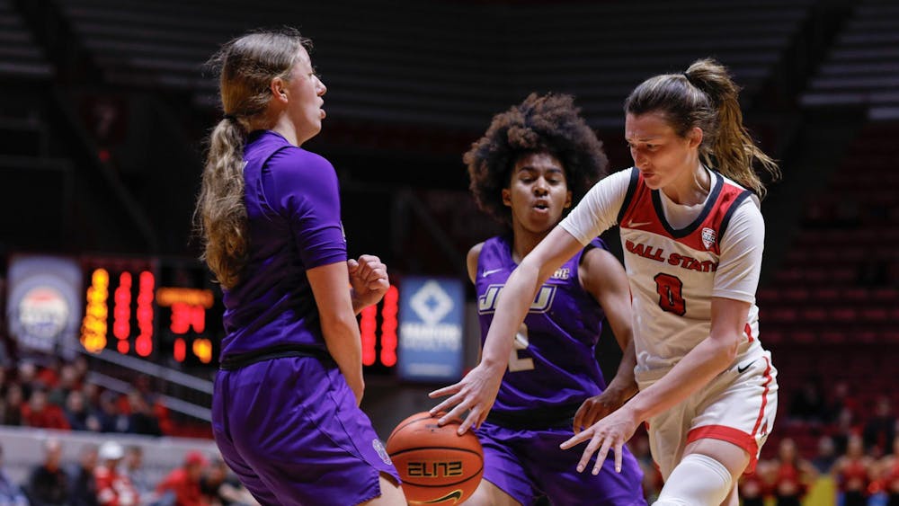 Junior Ally Becki makes a split pass through the defense against James Madison Feb. 11 at Worthen Arena. Becki had three points in the first half against the Dukes. Andrew Berger, DN 