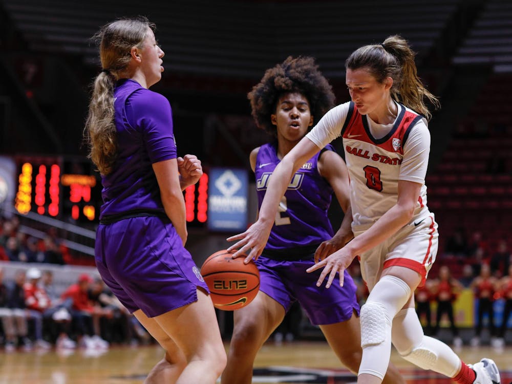 Junior Ally Becki makes a split pass through the defense against James Madison Feb. 11 at Worthen Arena. Becki had three points in the first half against the Dukes. Andrew Berger, DN 