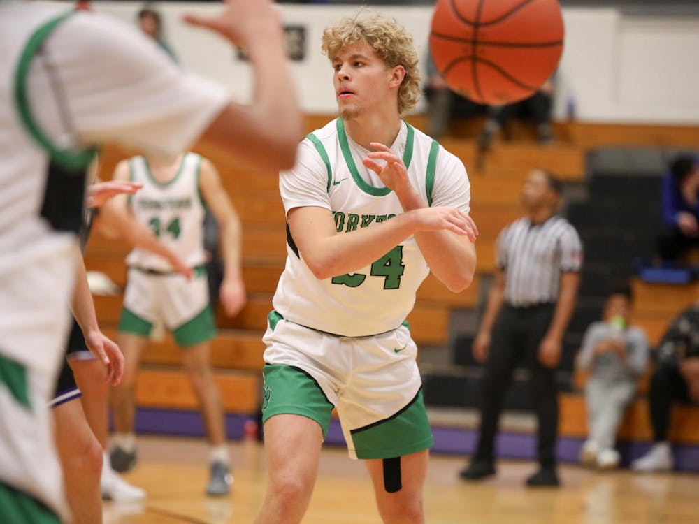 Yorktown sophomore Noah Long passes Dc. 14 during the Fieldhouse Classic at the Muncie Central Fieldhouse. Zach Carter, DN.
