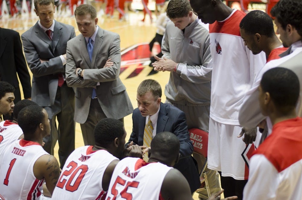 Head coach James Whitford talks to his team before the game against Western Michigan on Feb. 26 at Worthen Arena. DN PHOTO BREANNA DAUGHERTY 