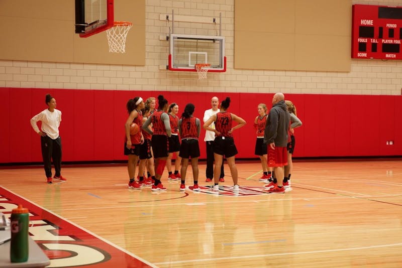 The team huddles up to take direction for head coach Brady Sallee during a practice at Dr. Don Schondell Practice Center on Dec 5, 2018. Gabi Glass,DN