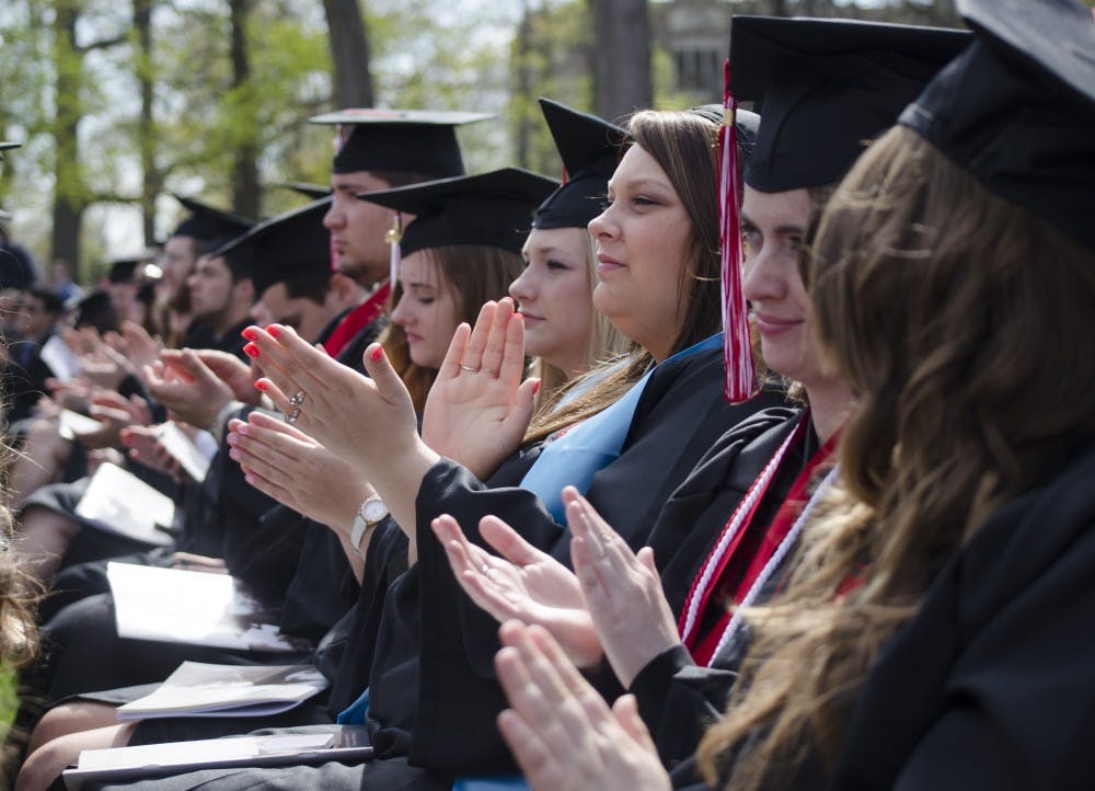 Graduates applaud during the commencement ceremony on May 3. A new program from the Indiana Commission for Higher Education hopes to graduate more students on time by encouraging them to take 15 credit hours per semester. DN FILE PHOTO BREANNA DAUGHERTY