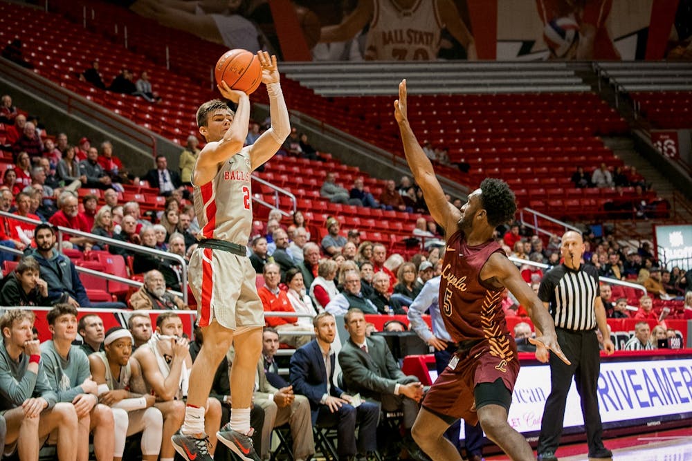 <p>Freshman guard, Luke Bumbalough (2), spots up for a three point attempt against Loyola Chicago Dec. 3, 2019, in John E. Worthen Arena. Bumbalough finished with two three pointers for the night, the Cardinals are now 4-4 on the season after their loss to Loyola. <strong>Omari Smith, DN</strong></p>