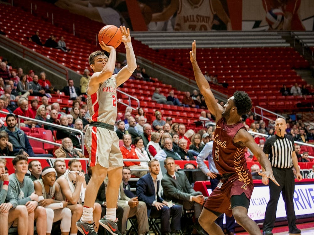 Freshman guard, Luke Bumbalough (2), spots up for a three point attempt against Loyola Chicago Dec. 3, 2019, in John E. Worthen Arena. Bumbalough finished with two three pointers for the night, the Cardinals are now 4-4 on the season after their loss to Loyola. Omari Smith, DN