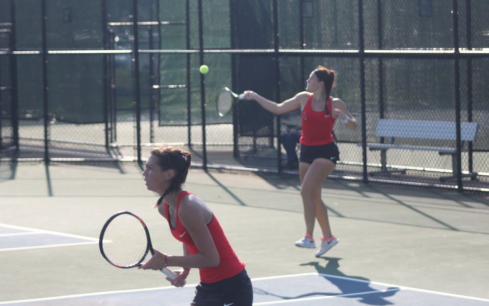 Senior Isabelle Dohanics attempts to return the ball to her opponents during a doubles match against Dayton on the first day of the Hidden Dual Tournament Sept. 22, 2018, at the Cardinal Creek Tennis Center. Dohanics' doubles partner is Senior Audrey Berger. Patrick Murphy,DN