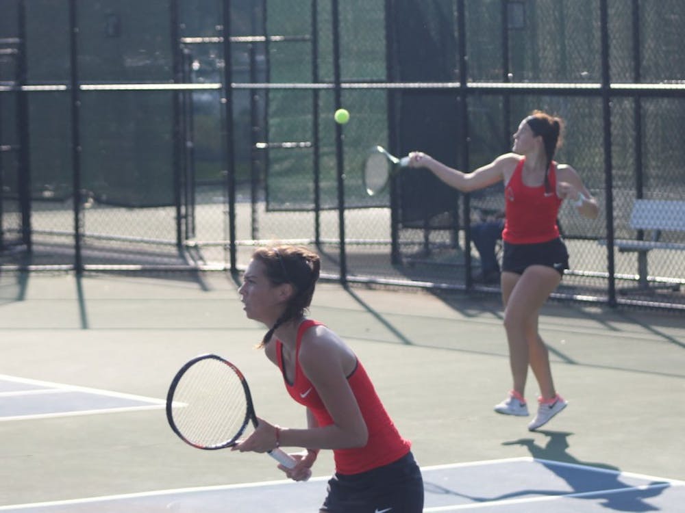 Senior Isabelle Dohanics attempts to return the ball to her opponents during a doubles match against Dayton on the first day of the Hidden Dual Tournament Sept. 22, 2018, at the Cardinal Creek Tennis Center. Dohanics' doubles partner is Senior Audrey Berger. Patrick Murphy,DN