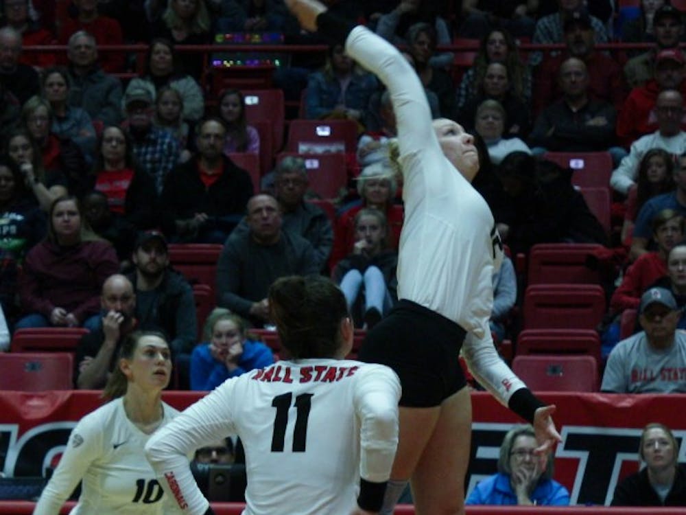 Junior Sydnee VanBeek spikes the ball at the Ball State Women's Volleyball match against Akron Nov.10, 2018, at John E. Worthen Arena. VanBeek scored the winning point of the fifth set to give the Cardinals the match win. Tailiyah Johnson,DN