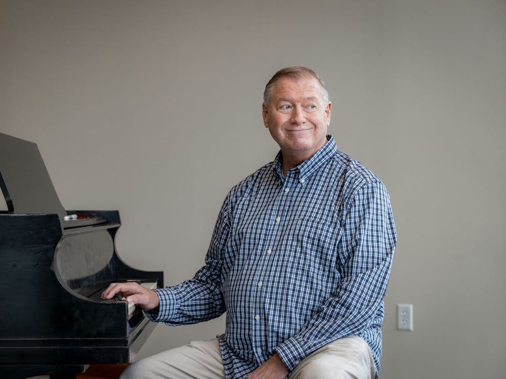 Associate Professor of Musical Theatre Michael Rafter poses at a piano April 20, 2021 in Muncie, Ind. Ball State University Creative Services, Photo Provided