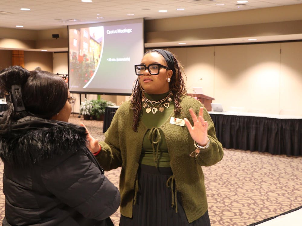 SGA President Chelsea Murdock asks a senator a question. Landon Jones, DN.