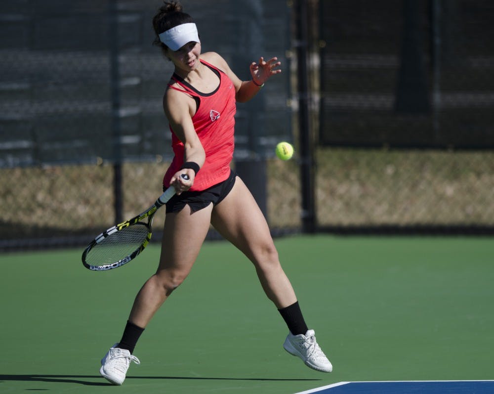 Senior Rosalinda Calderon hits a forehand during her doubles match against IUPUI on Feb. 19. Emma Rogers // DN